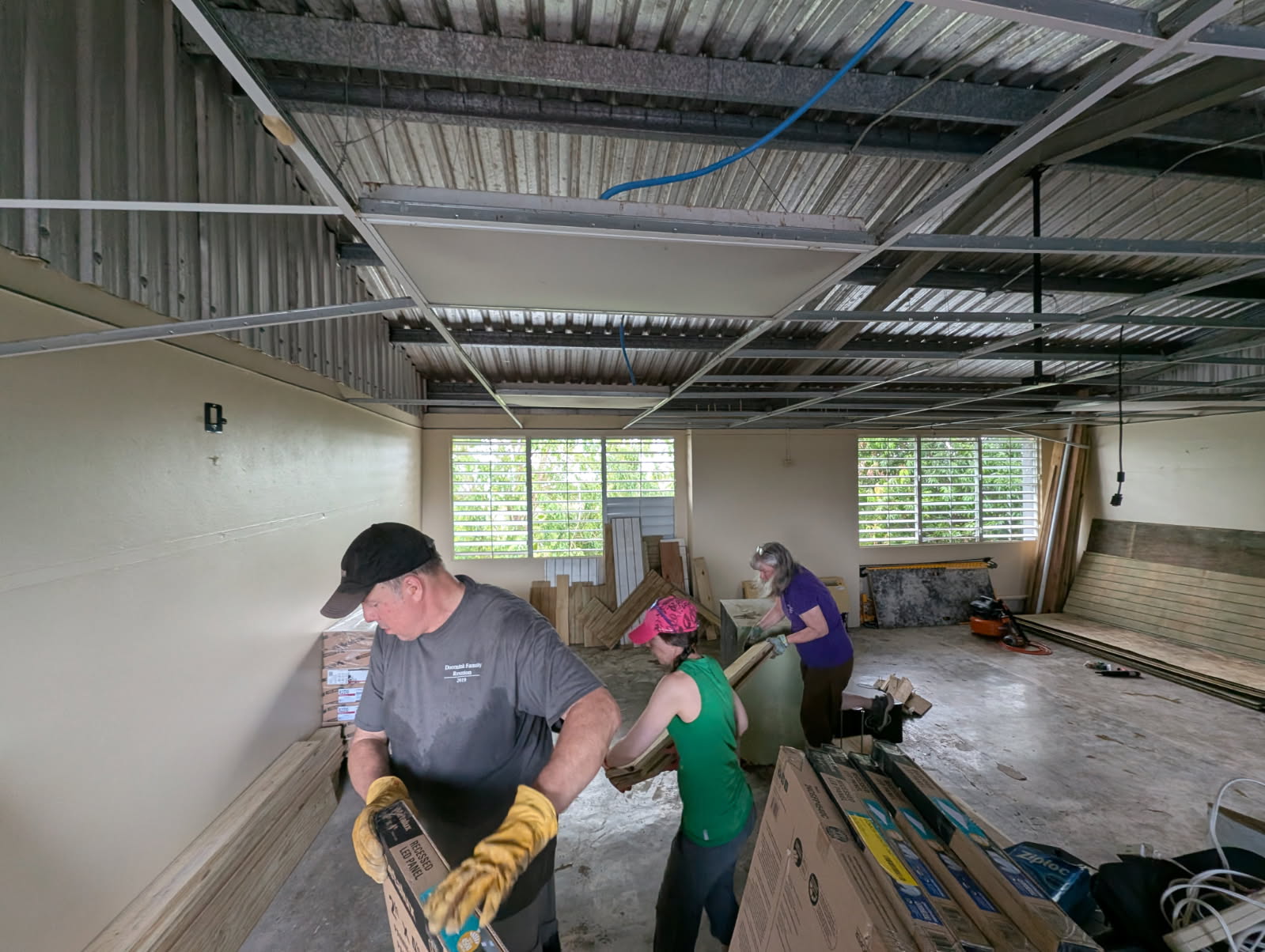 69941741458582446 John Doornink, Tess Doornink and Val Williamson even had some time left over, once the rooms were done, to organize supplies in the next big room that needs to be divided (maybe next year!).