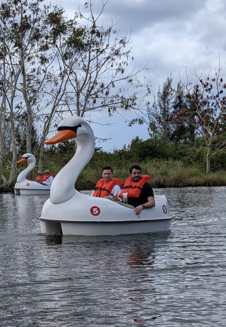 7330608038496064977 Just a little father-son-swan bonding time for Michael & Elijah Dekker.