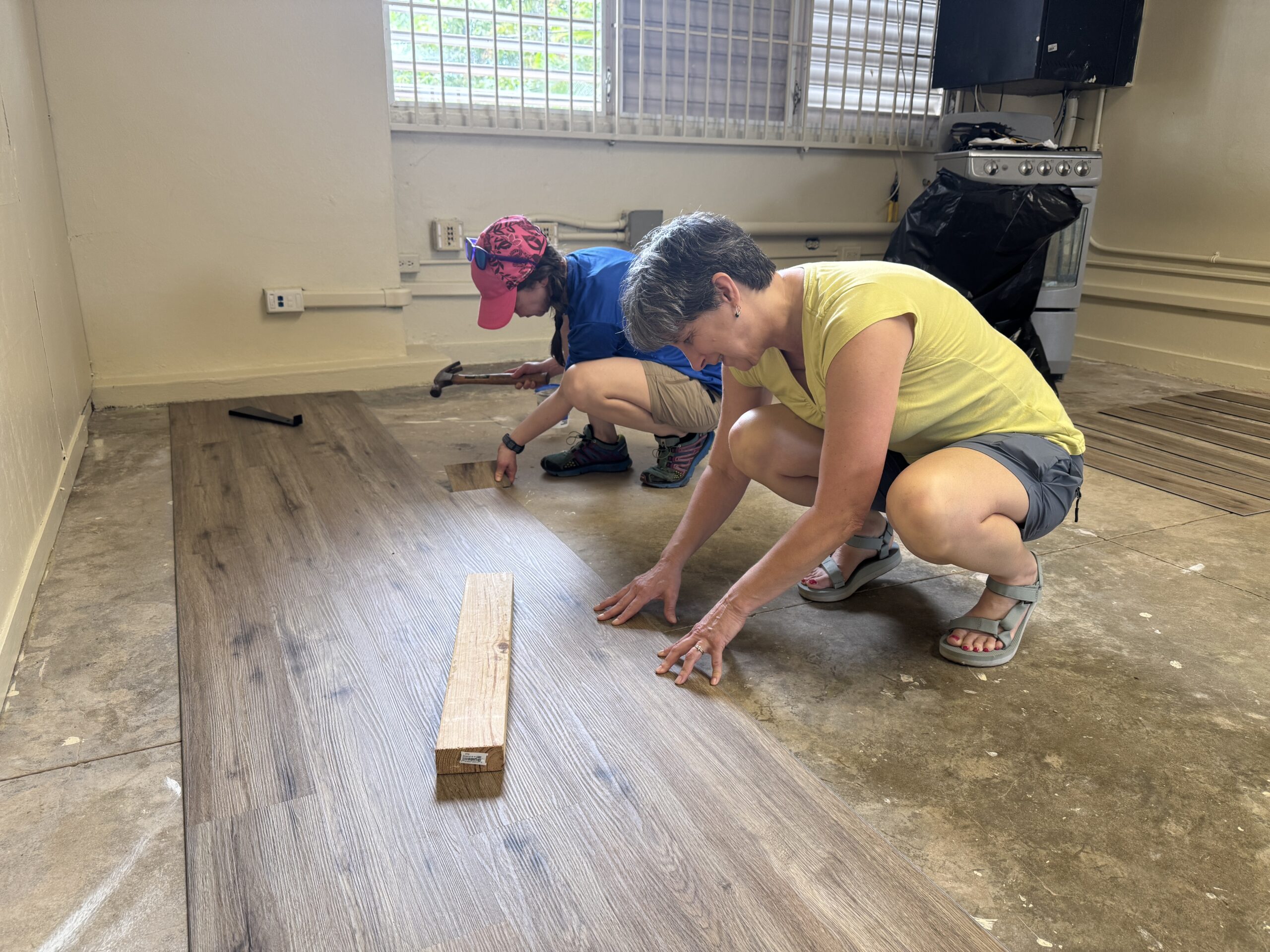 IMG_3566 Laying flooring is not for the weak! Val Williamson and Teresa Brooks' knees were feeling it by bedtime that evening.