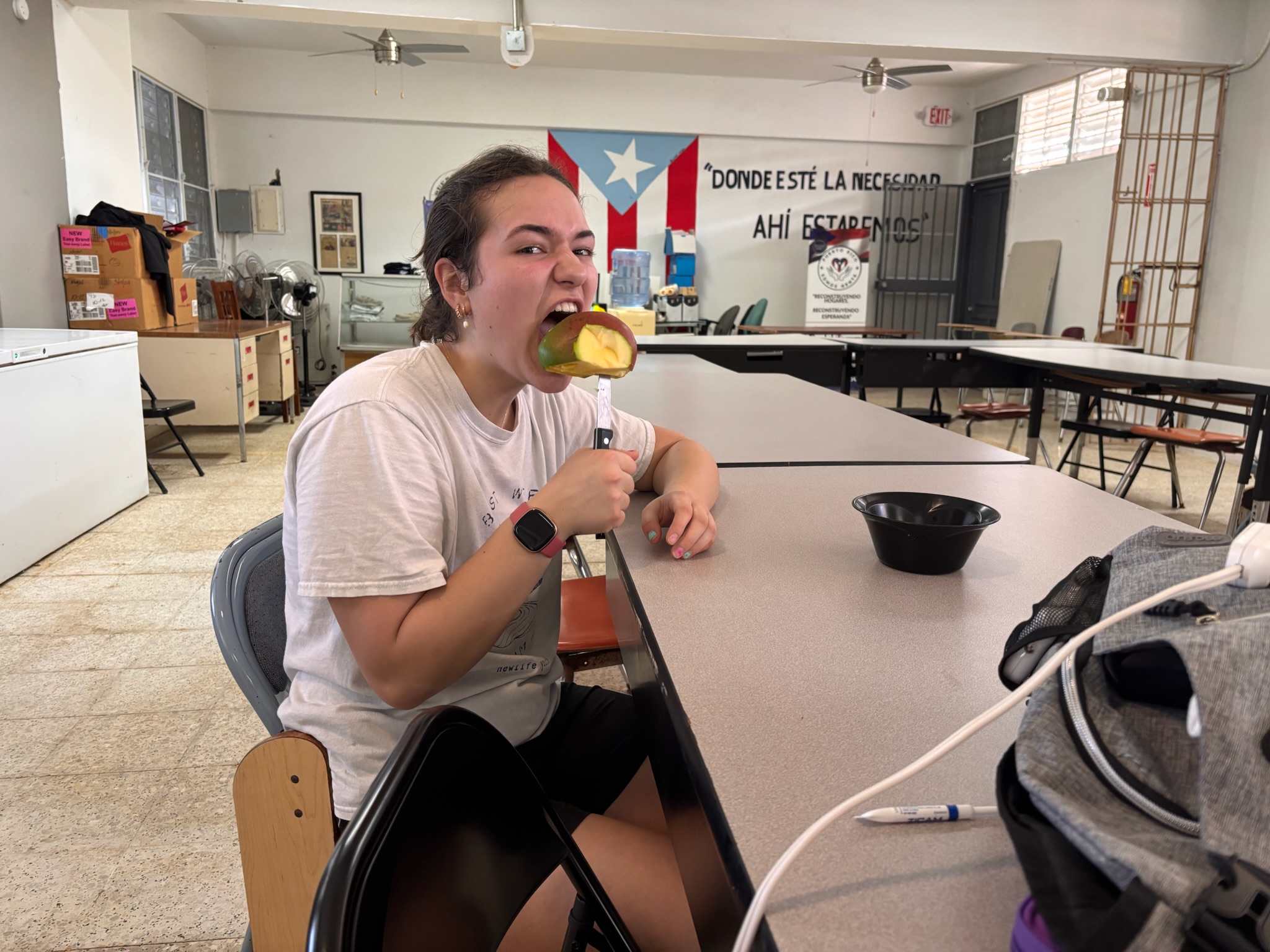 IMG_4169 2 Leah Morse struggled to figure out the correct way to eat a fresh mango during a break.